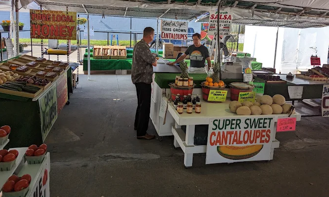 Inside Everyday Produce - customers shopping under the tent