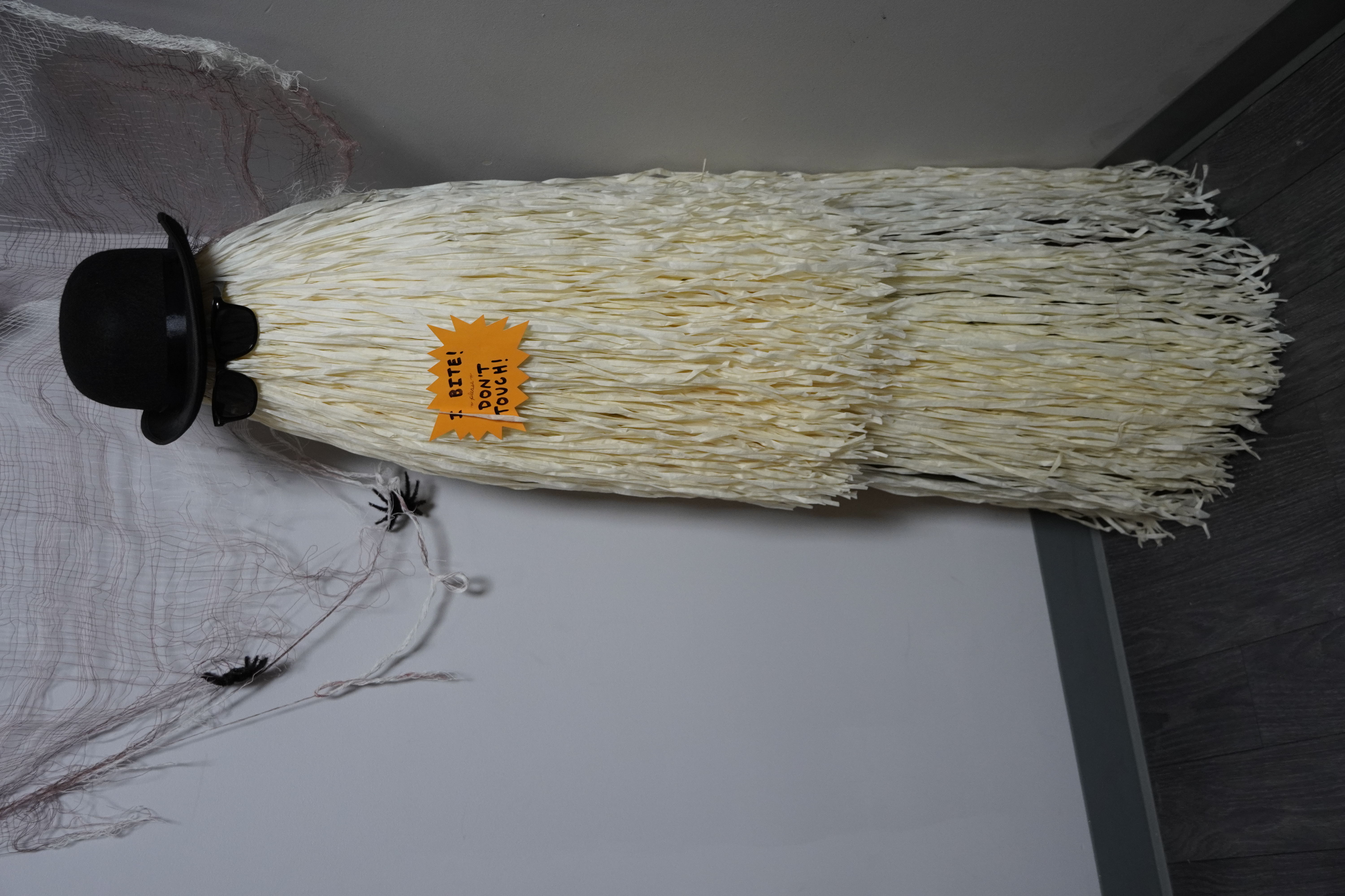 Wall of Halloween masks and props on the upstairs Spookier floor.