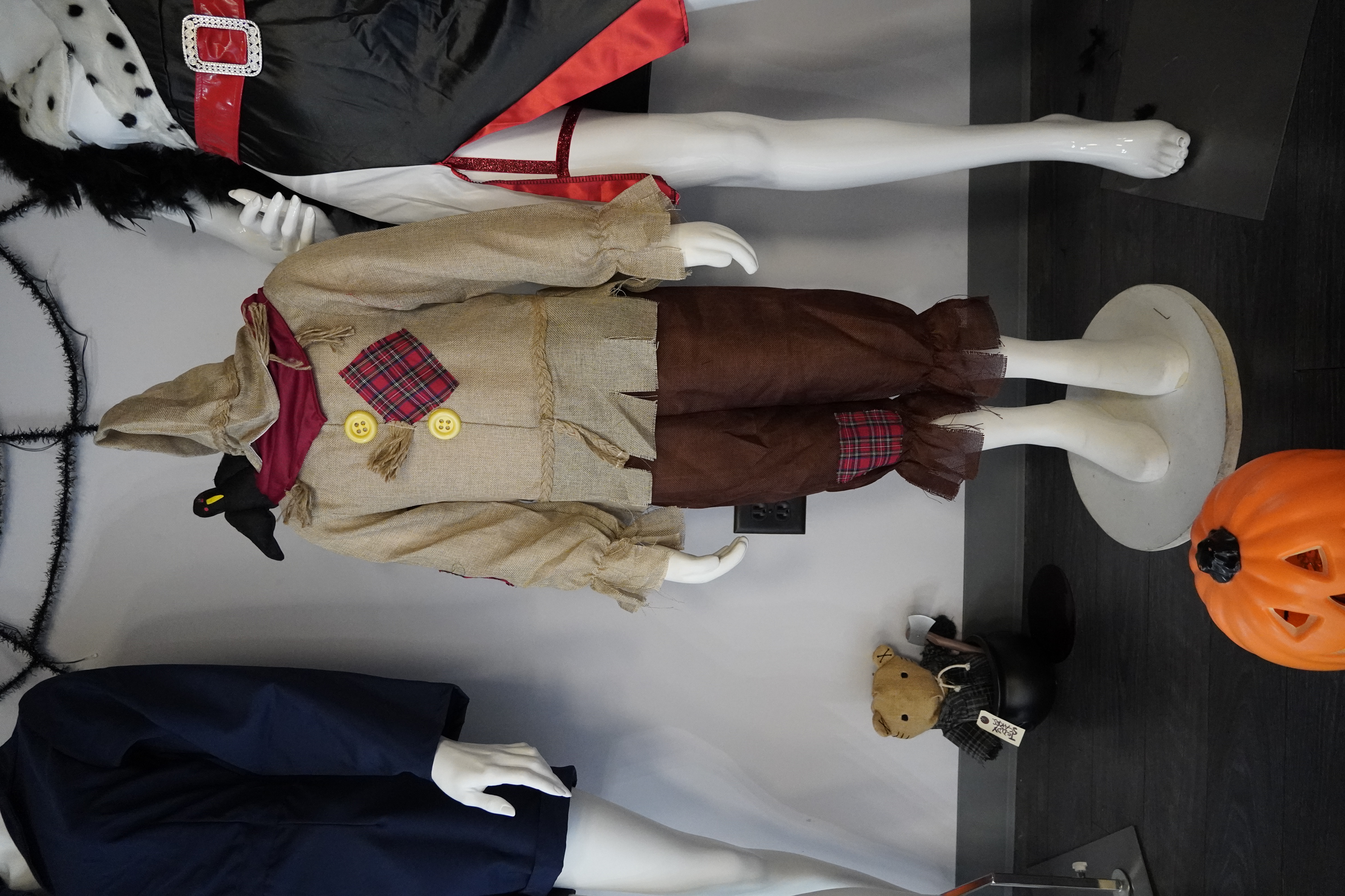 Display of wigs, makeup kits, and costume accessories upstairs.